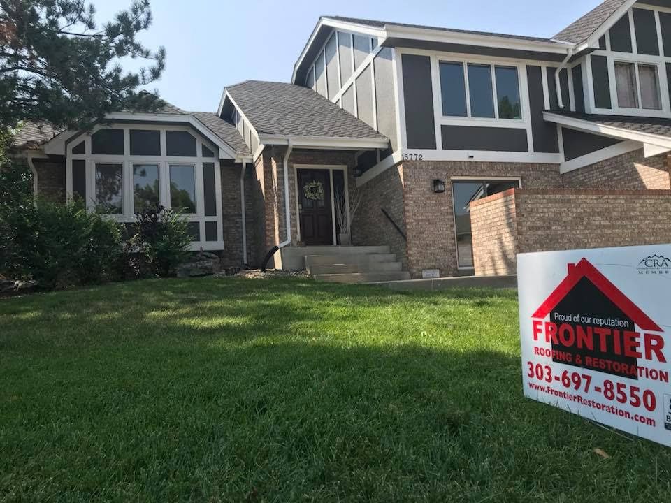 A home with a sign in front of it